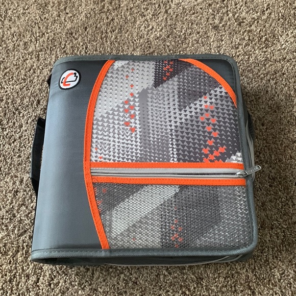 This is a case it binder perfect for holding papers that is orange and gray - Picture 1 of 4